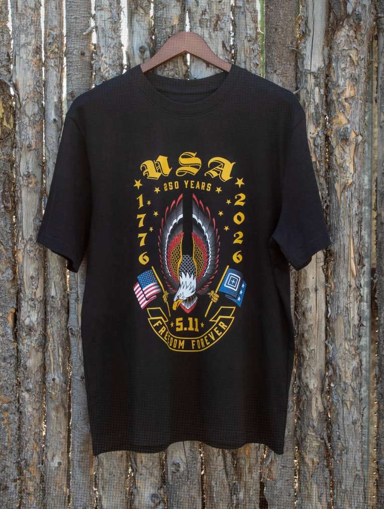 Americana tee hangs on a wooden background