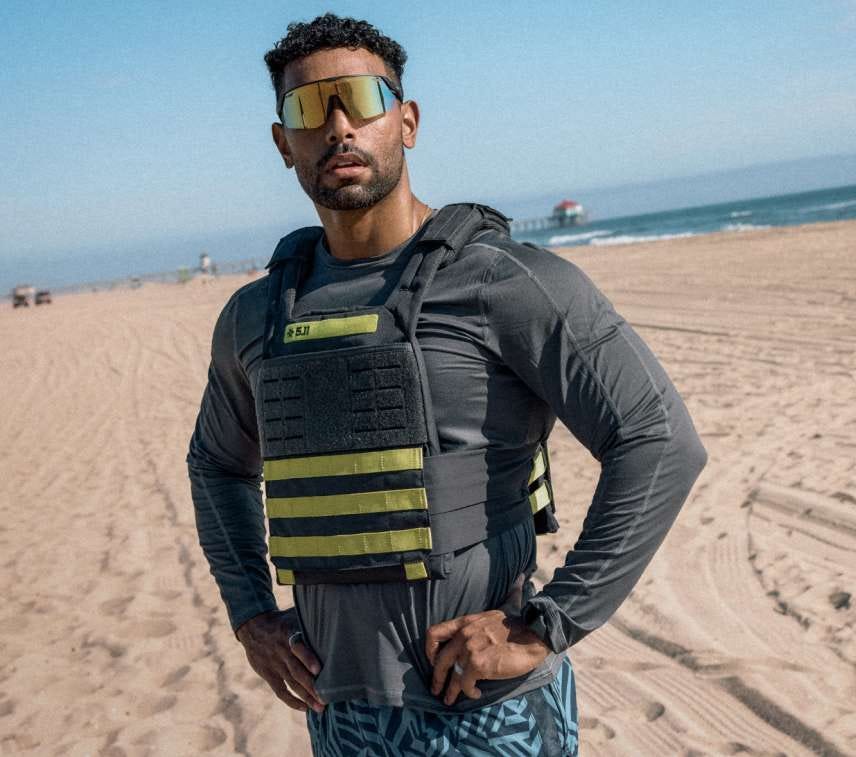 Man wears Taconic Weight Vest on the beach