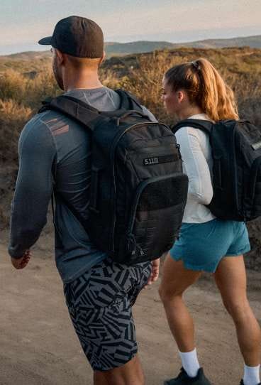 Two people hiking with the Ruck Pack