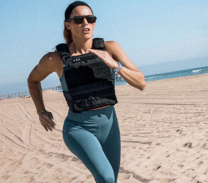 Woman runs on a beach