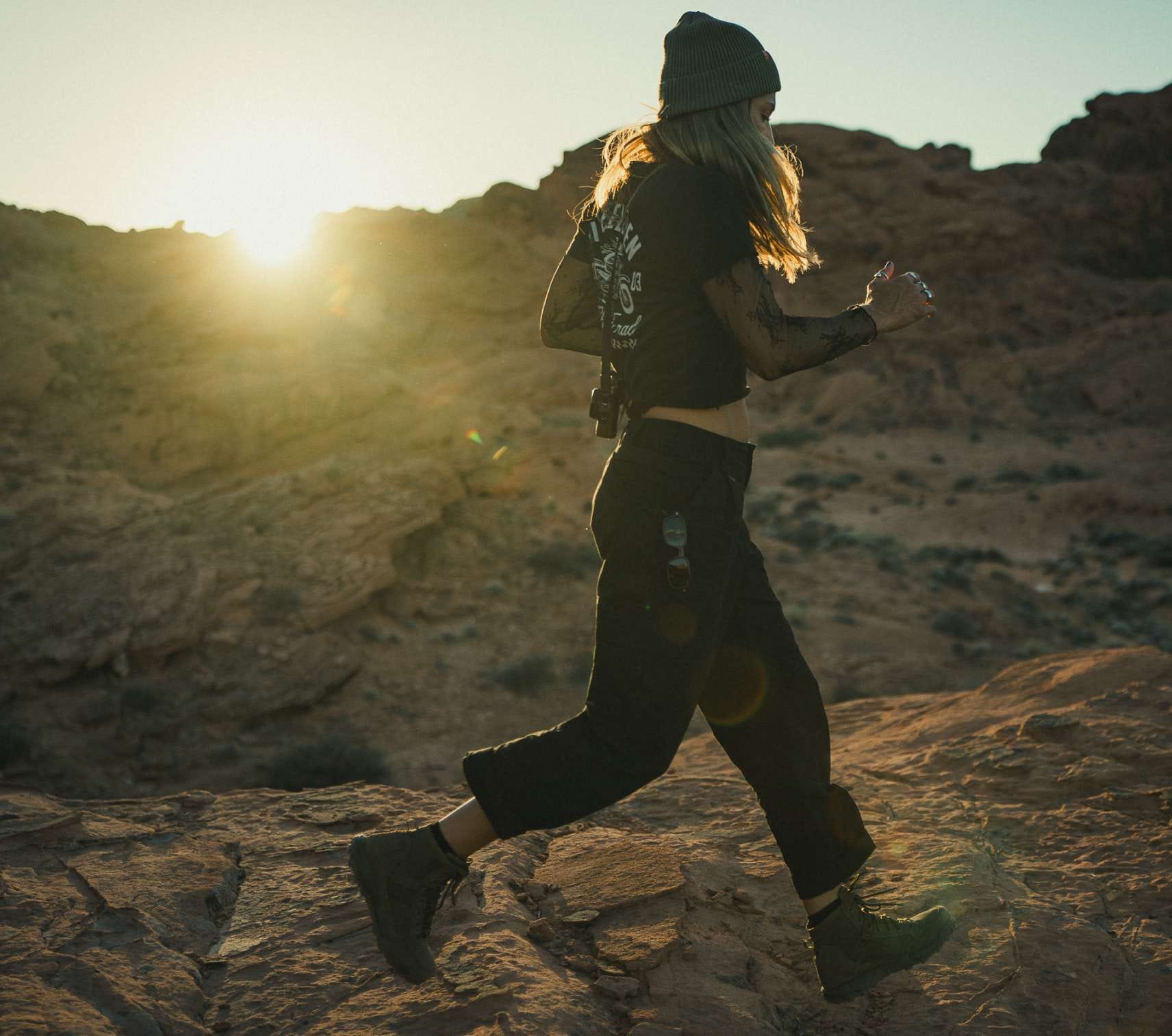 Woman runs along a hill