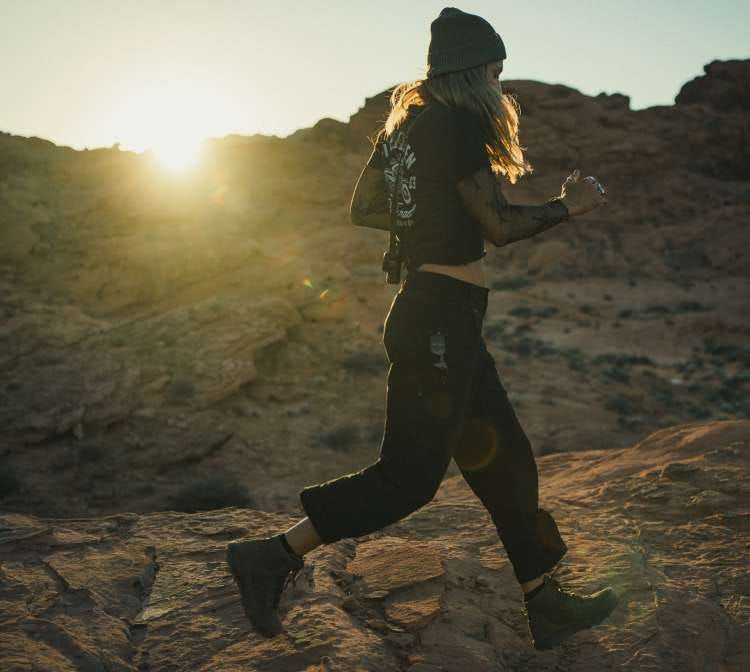 Woman runs along a hill