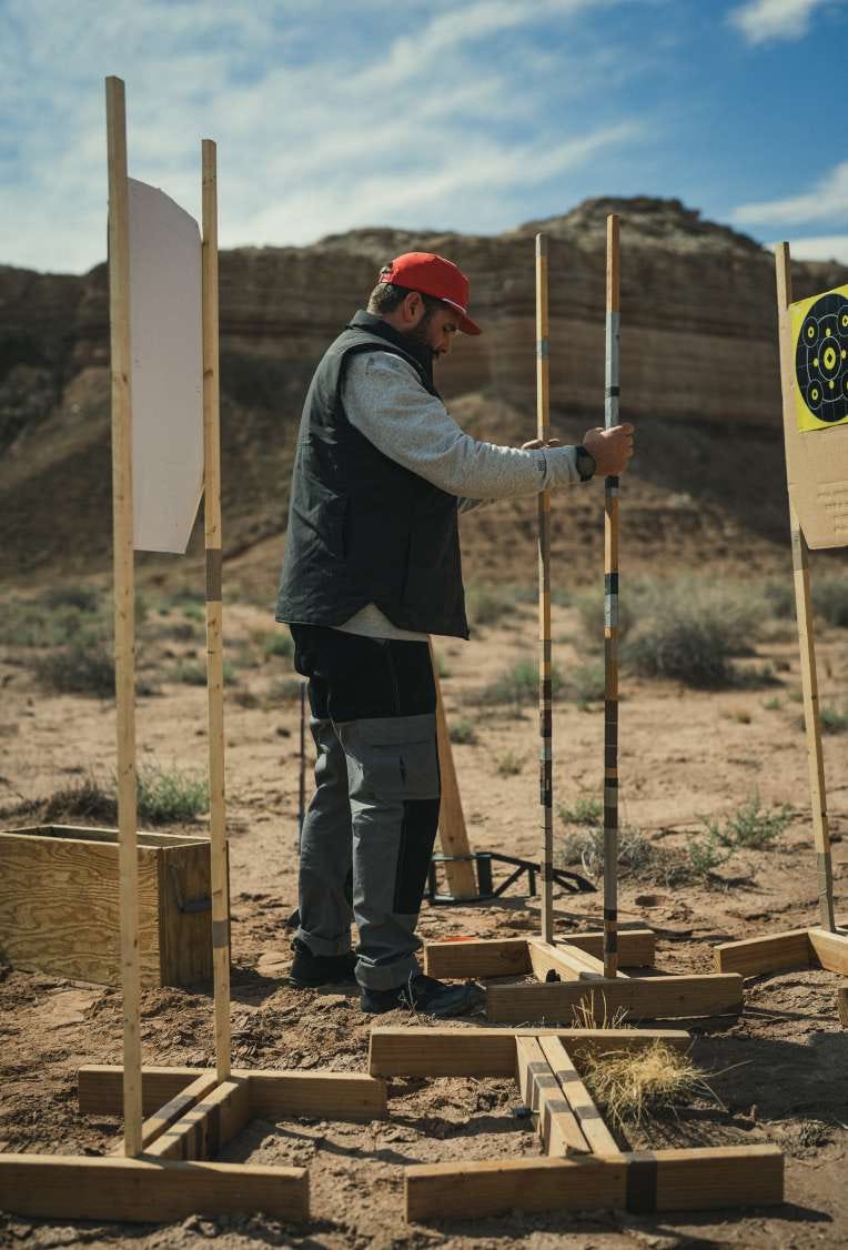 Man sets up a target on a range