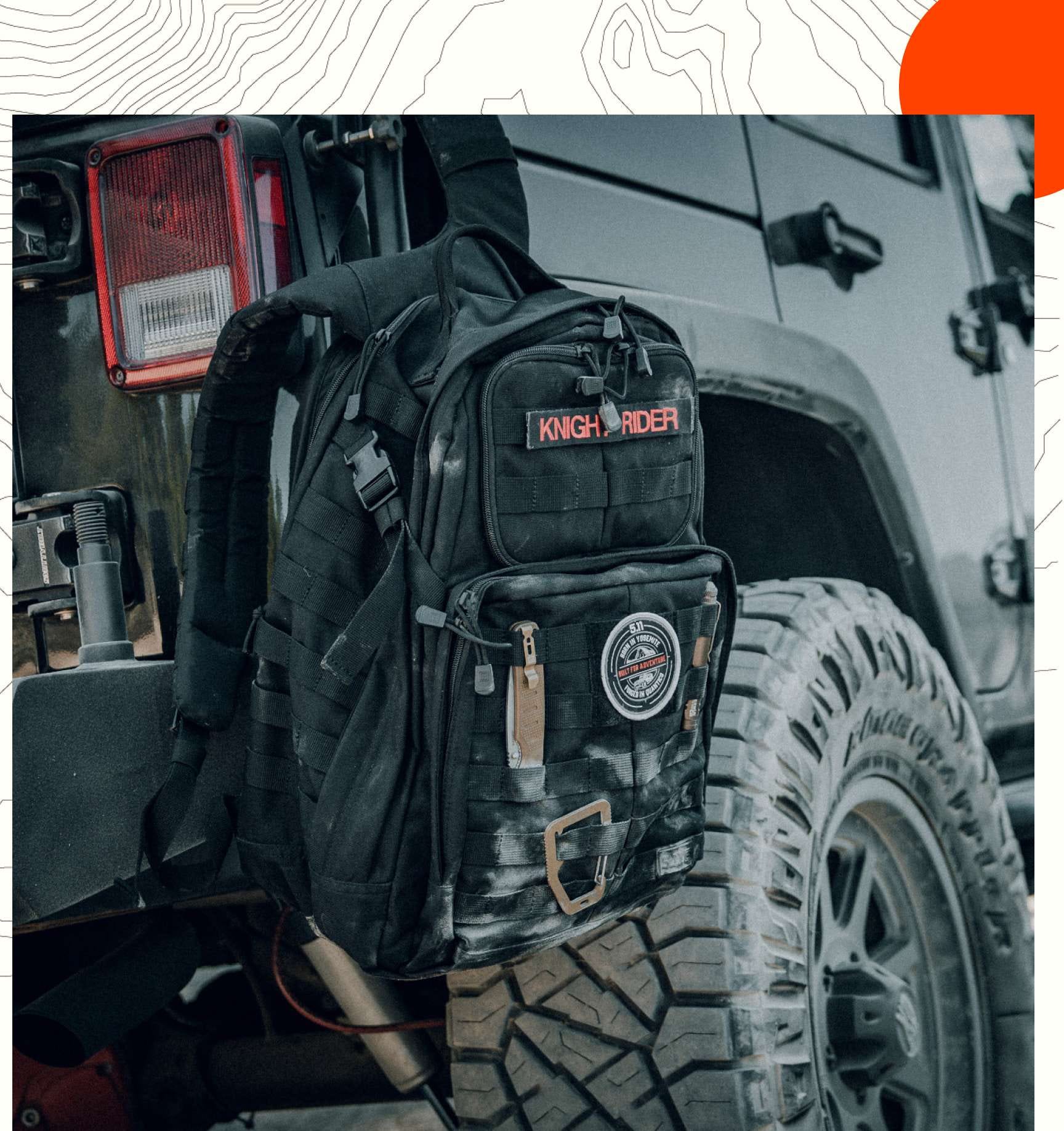 A RUSH® 24 Backpacks hangs off the back of a vehicle