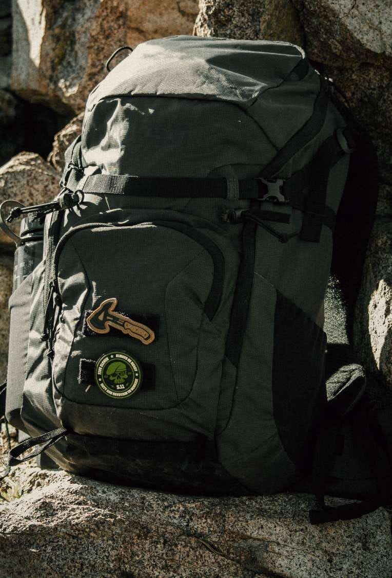 Skkyweight backpack rests on a rock