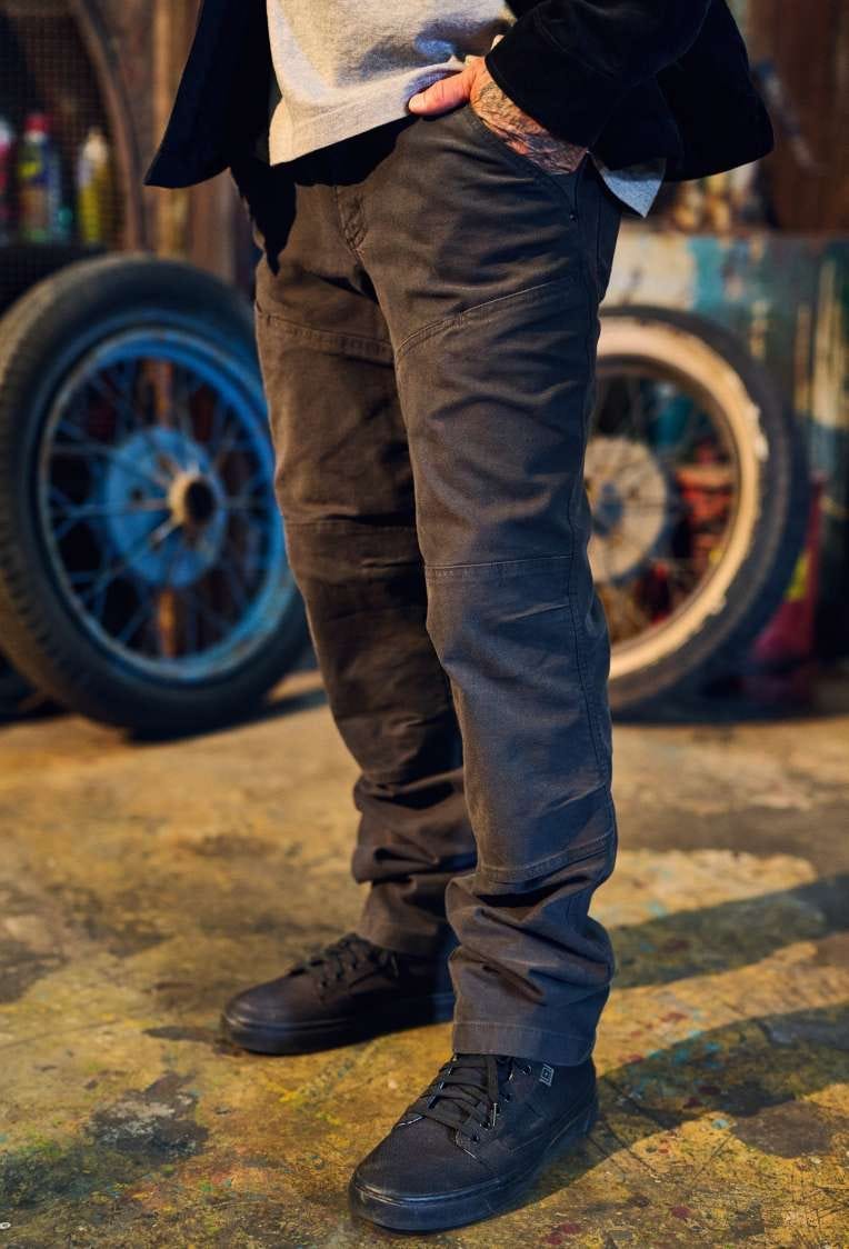 Man wearing pants with hands in pockets