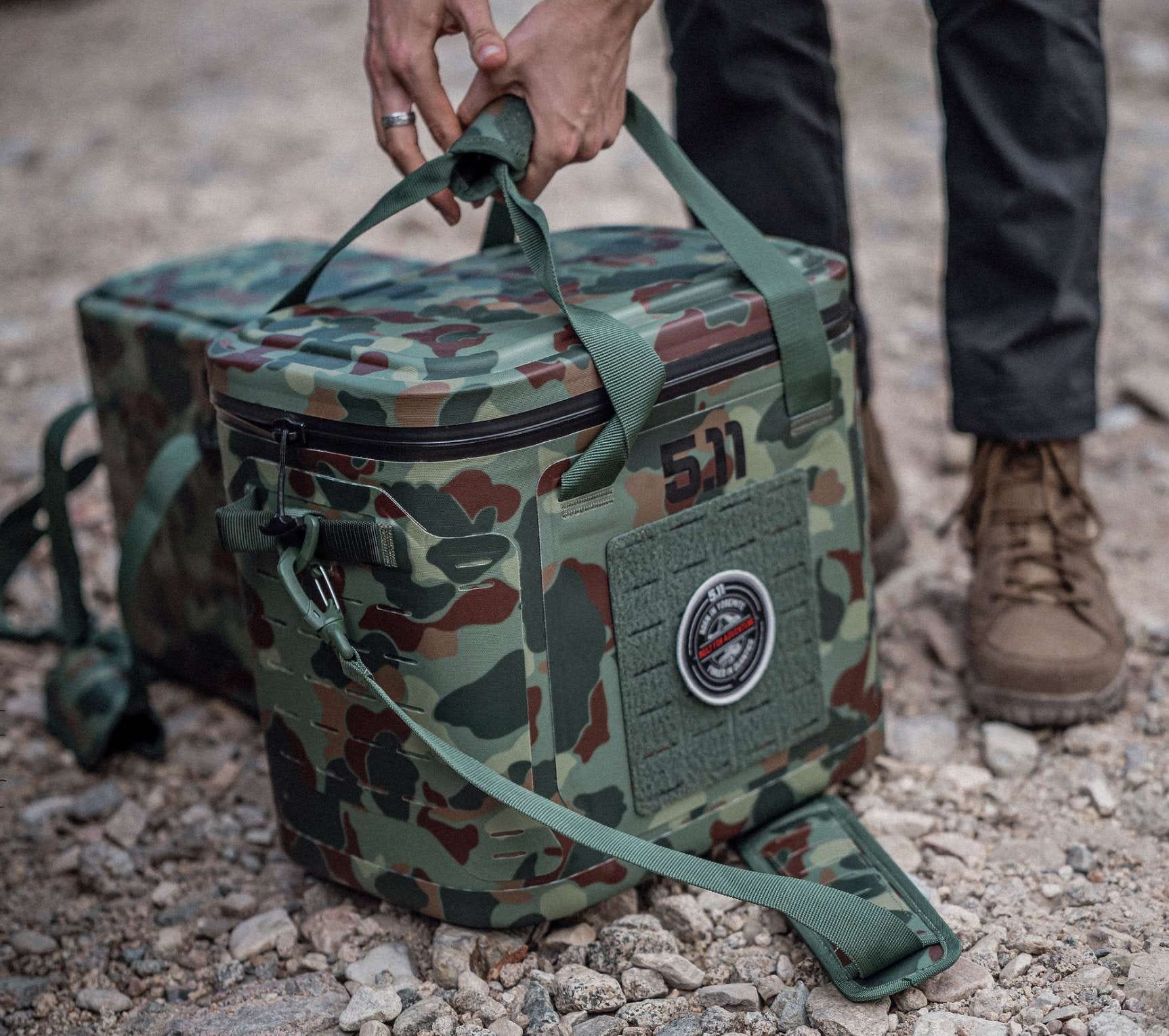 Camo cooler on the ground being picked up