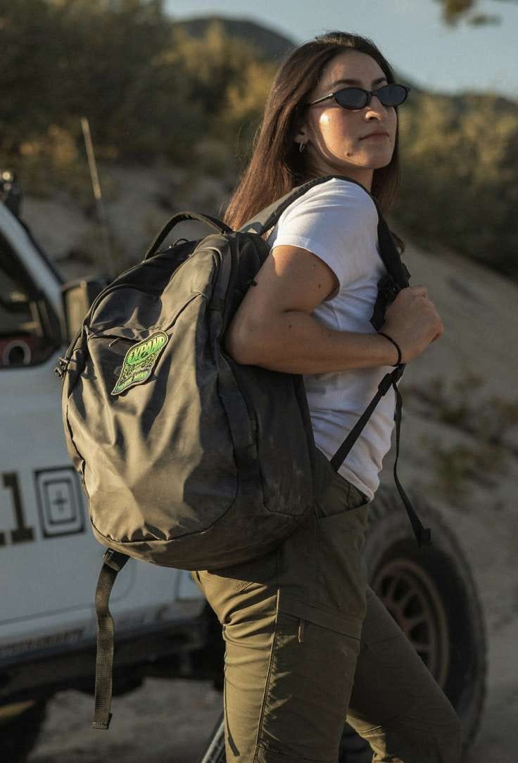Woman with Allhaula backpack slung over shoulder
