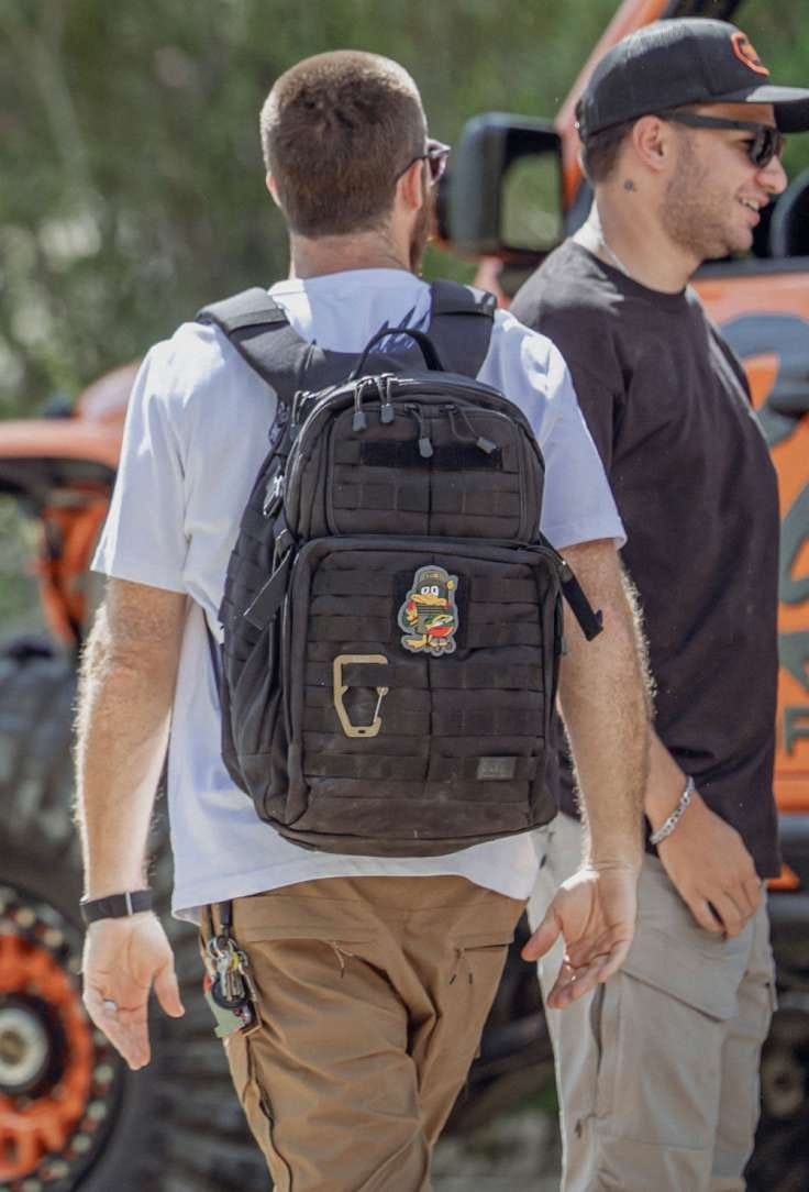 RUSH 24 on the back of a man walking away