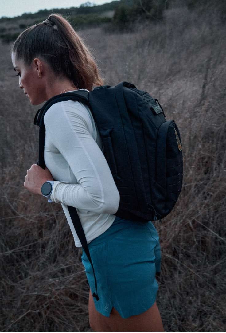 Woman wearing rucking pack