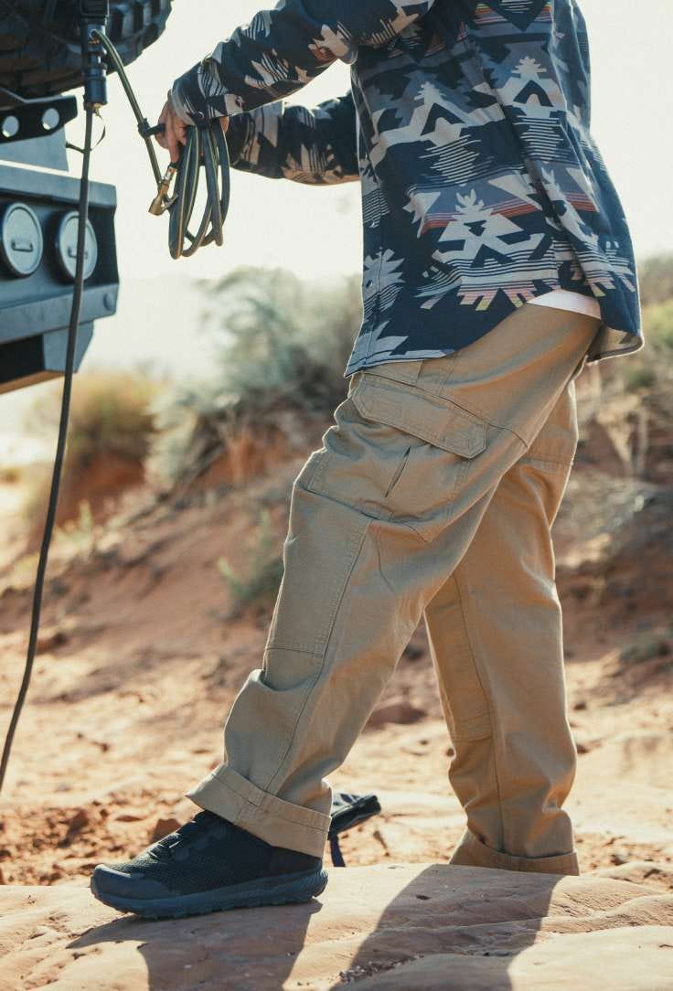 Man with rope in sand