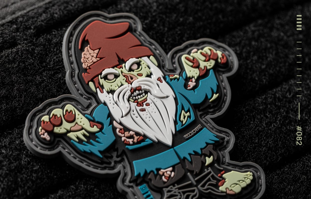 A closeup of a tactical 5.11 Patch of the Month in the shape of a zombie gnome